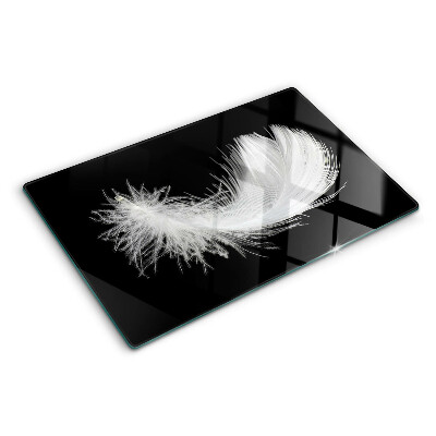 Planche à découper en verre Plume sur fond noir