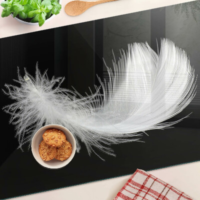Planche à découper en verre Plume sur fond noir