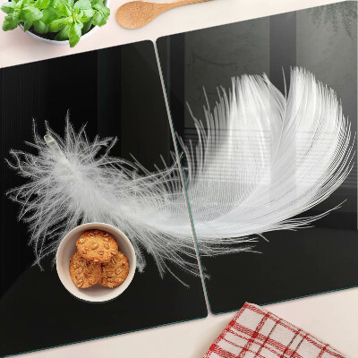 Planche à découper en verre Plume sur fond noir