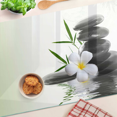 Planche à découper verre Fleurs et pierres sur l'eau
