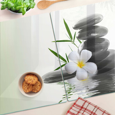 Planche à découper verre Fleurs et pierres sur l'eau