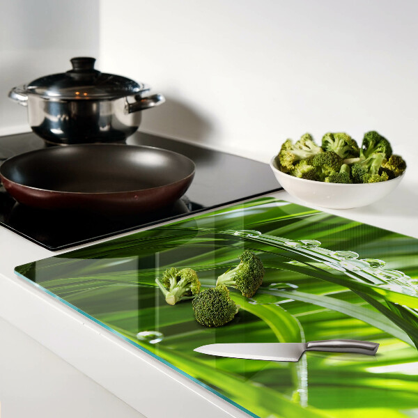 Planche à découper en verre Gouttes d'eau sur l'herbe