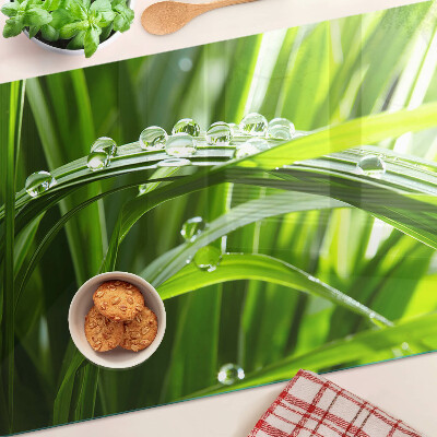 Planche à découper en verre Gouttes d'eau sur l'herbe