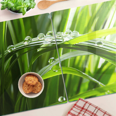 Planche à découper en verre Gouttes d'eau sur l'herbe