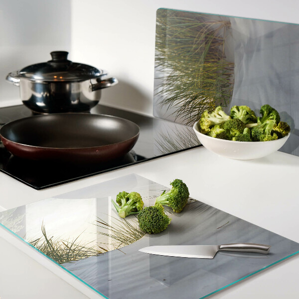Planche à découper verre L'herbe verte contre le ciel