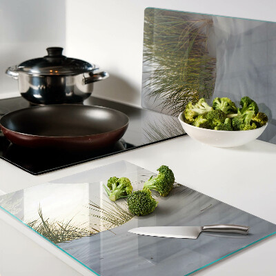 Planche à découper verre L'herbe verte contre le ciel