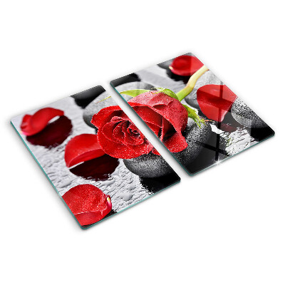Planche à découper verre Rose sur pierres avec gouttes d'eau