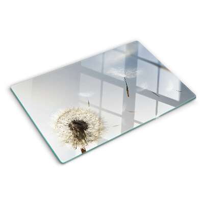 Planche à découper verre Pissenlits en arrière-plan de la fenêtre