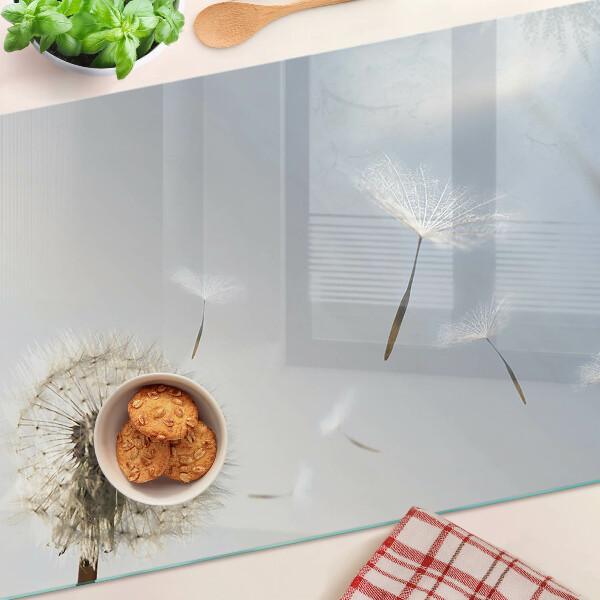 Planche à découper verre Pissenlits en arrière-plan de la fenêtre