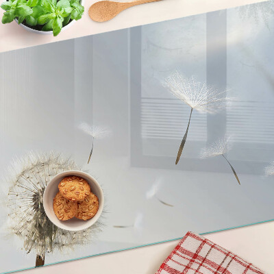 Planche à découper verre Pissenlits en arrière-plan de la fenêtre