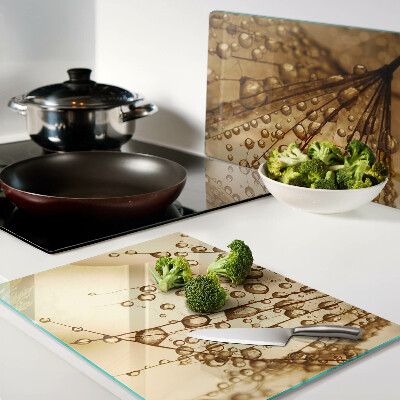 Planche à découper en verre Gouttes d'eau sur une plante