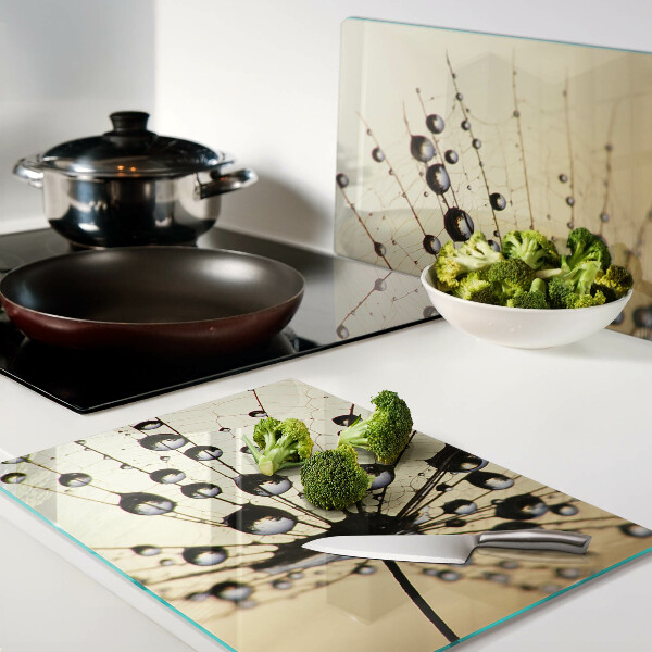Planche à découper en verre Gouttes d'eau sur une toile d'araignée