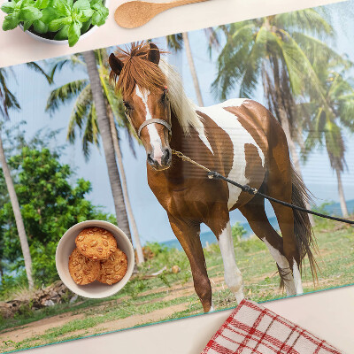 Planche à découper verre Un cheval avec des palmiers en arrière-plan