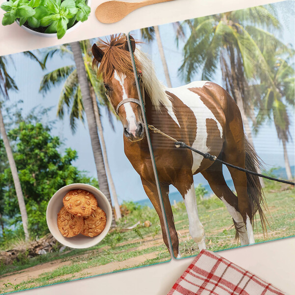 Planche à découper verre Un cheval avec des palmiers en arrière-plan