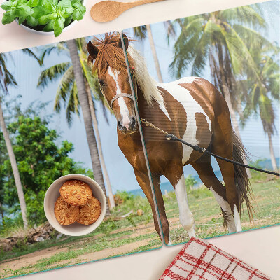 Planche à découper verre Un cheval avec des palmiers en arrière-plan