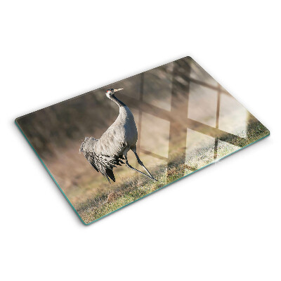 Planche à découper en verre Une grue sur fond de paysage