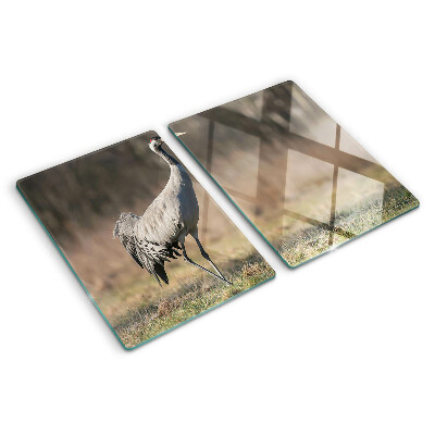 Planche à découper en verre Une grue sur fond de paysage