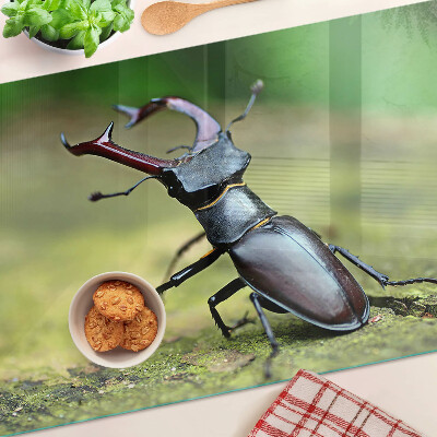Planche à découper verre Lucane cerf-volant sur fond vert