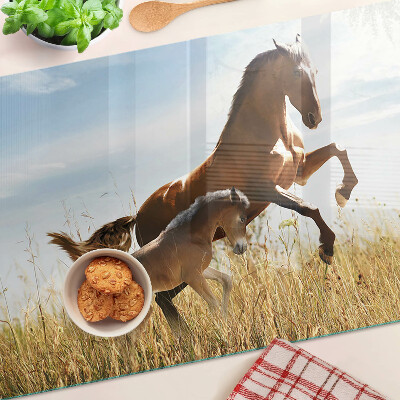 Planche à découper en verre Chevaux dans un pré au soleil