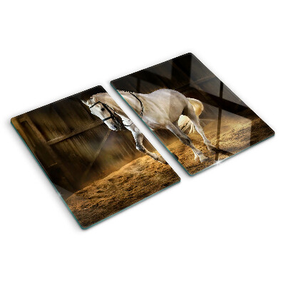 Planche à découper en verre Un cheval en mouvement dans l'écurie