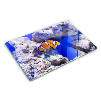 Planche à découper verre Poisson-clown parmi les rochers