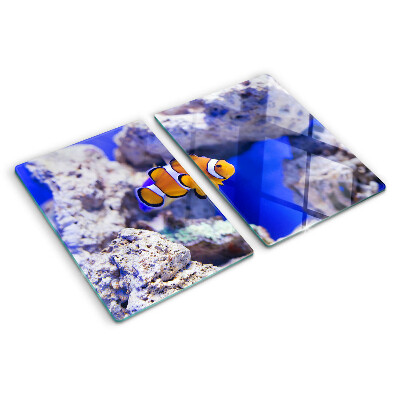 Planche à découper verre Poisson-clown parmi les rochers