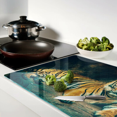 Planche à découper verre Un tigre couché sur les rochers
