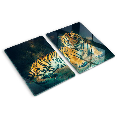 Planche à découper verre Un tigre couché sur les rochers