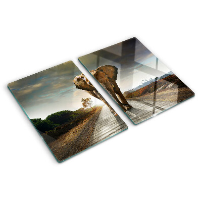 Planche à découper en verre Éléphant sur la route au coucher du soleil