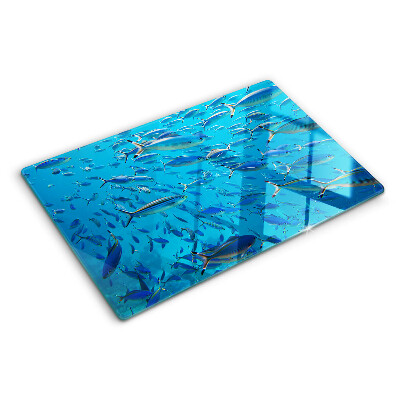 Planche à découper verre Un banc de poissons dans une eau claire