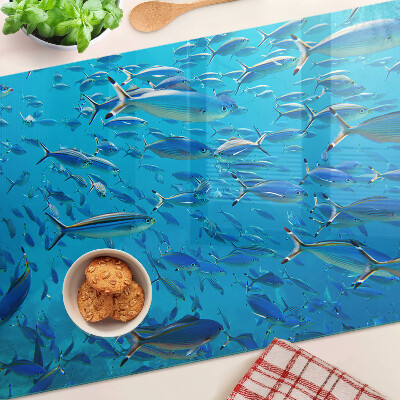 Planche à découper verre Un banc de poissons dans une eau claire