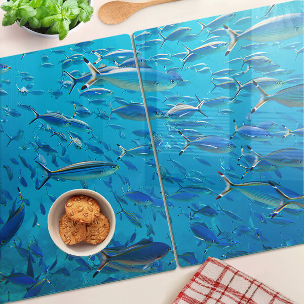 Planche à découper verre Un banc de poissons dans une eau claire