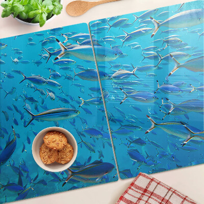 Planche à découper verre Un banc de poissons dans une eau claire
