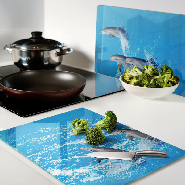 Planche à découper en verre Dauphins sautant par-dessus les vagues