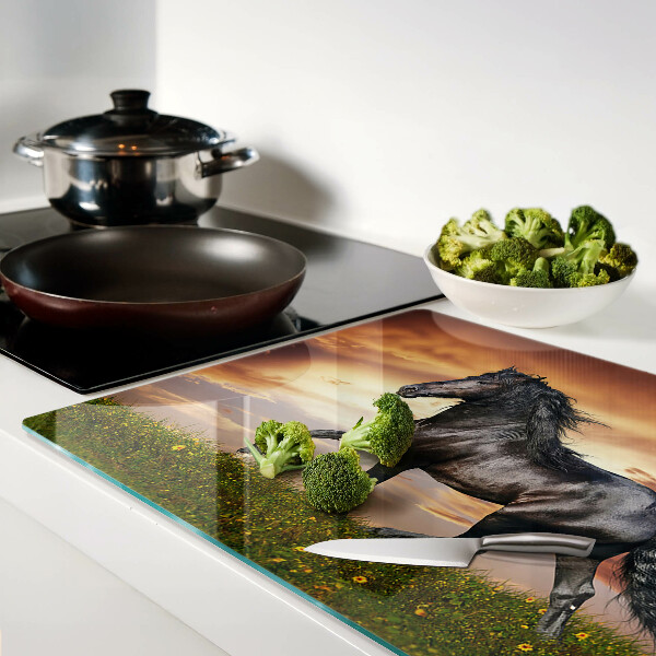 Planche à découper en verre Un cheval sur fond de soleil couchant