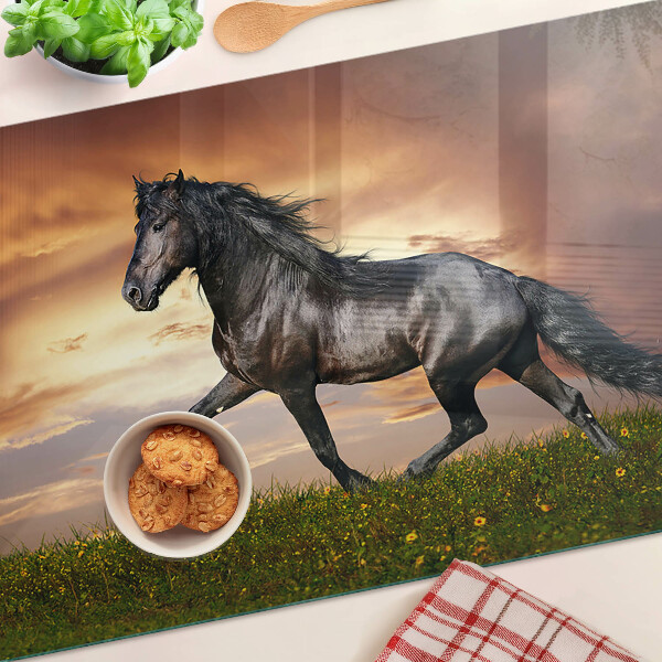 Planche à découper en verre Un cheval sur fond de soleil couchant