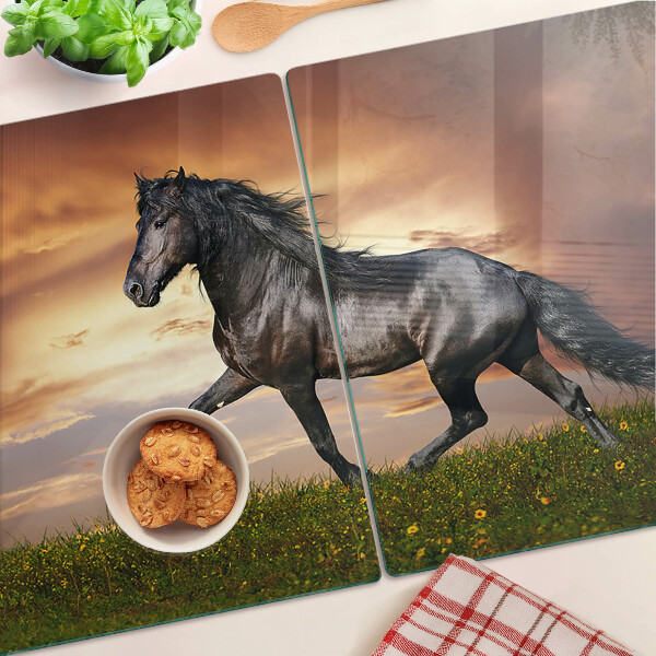 Planche à découper en verre Un cheval sur fond de soleil couchant