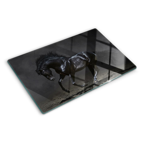 Planche à découper en verre Un cheval noir en mouvement