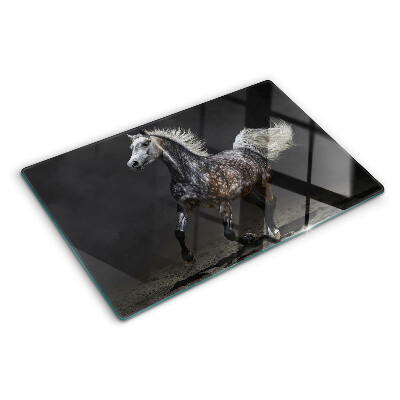 Planche à découper verre Un cheval tacheté en fuite