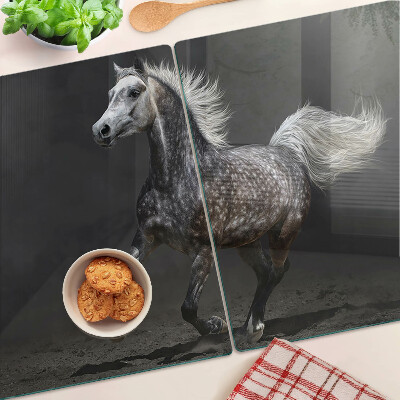 Planche à découper verre Un cheval tacheté en fuite
