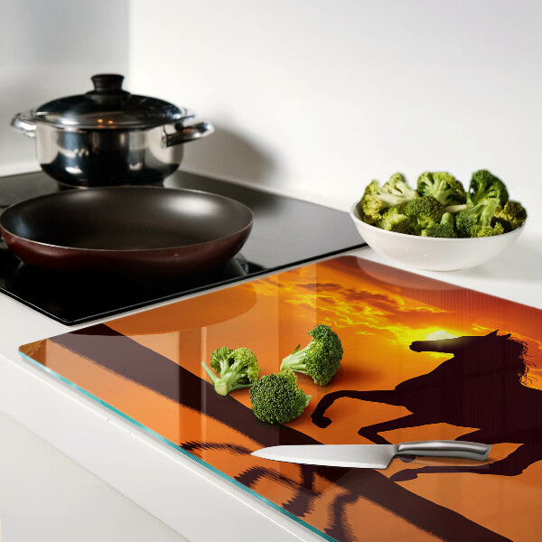 Planche à découper verre Un cheval sur fond de soleil couchant