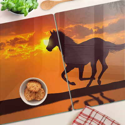 Planche à découper verre Un cheval sur fond de soleil couchant