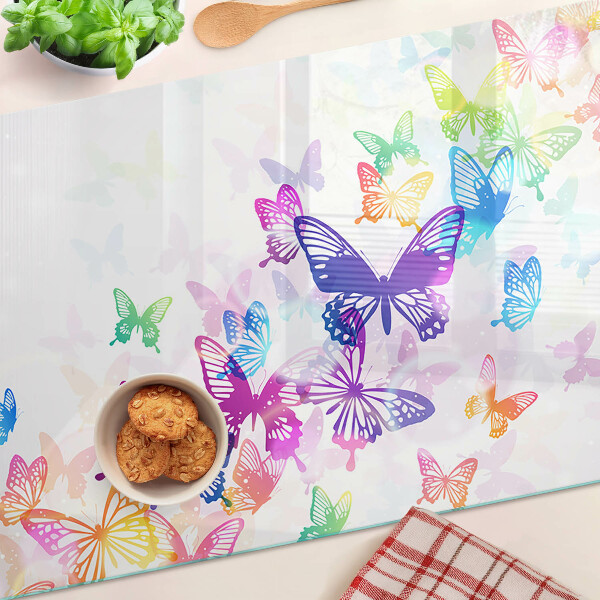 Planche à découper verre Un motif de papillons colorés s'envolant