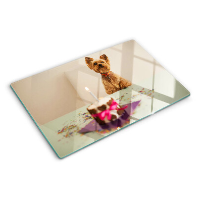 Planche à découper en verre Un chien à table avec un gâteau
