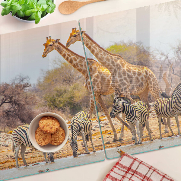 Planche à découper en verre Zèbre et girafe dans leur habitat naturel