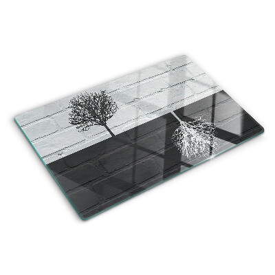 Planche à découper en verre Un arbre sur un fond de briques