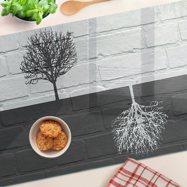 Planche à découper en verre Un arbre sur un fond de briques