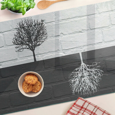 Planche à découper en verre Un arbre sur un fond de briques