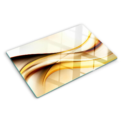 Planche à découper en verre Vagues abstraites dans des tons dorés