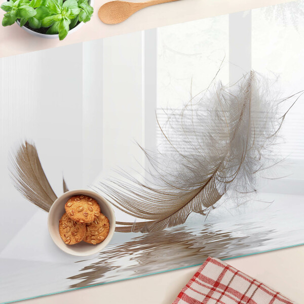 Planche à découper verre Une plume contre l'eau
